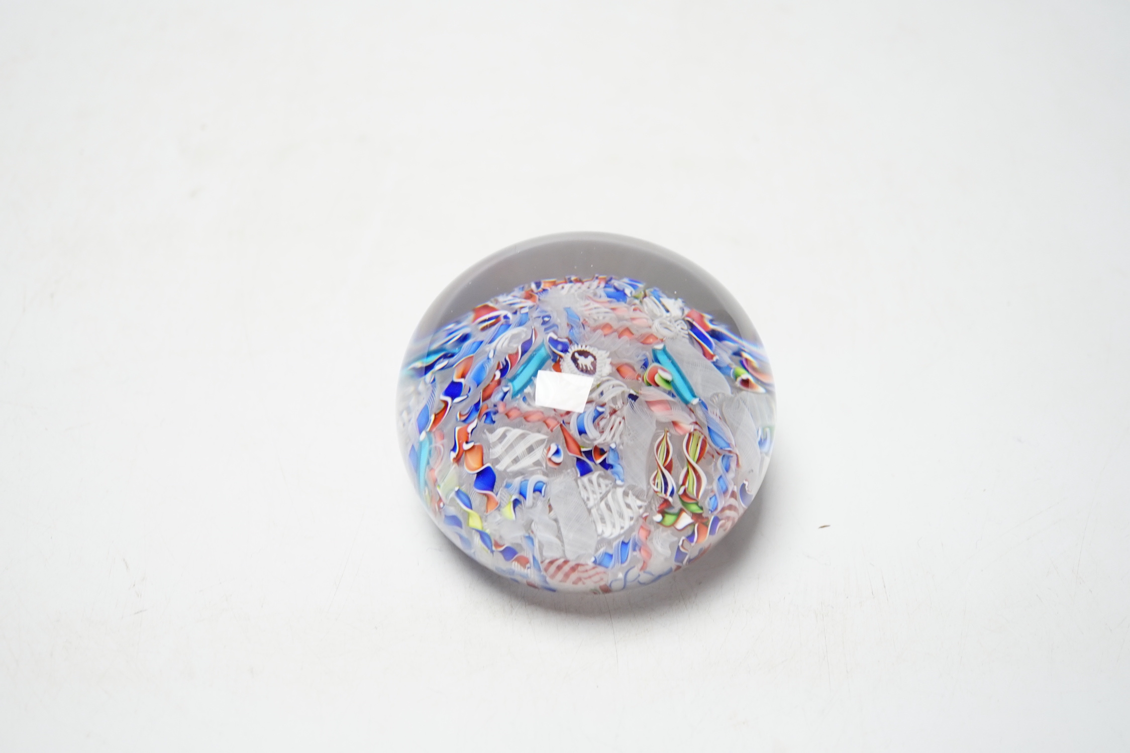 A St Louis paperweight with dog silhouette amid scrambled canes, 8cm diameter